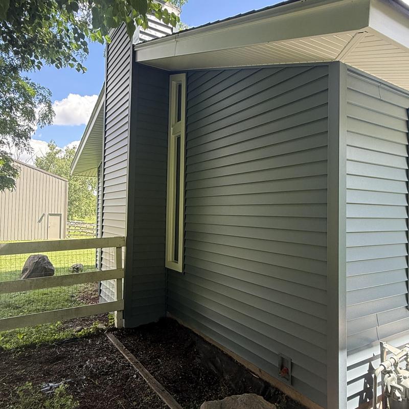 Vinyl siding installation on exterior wall