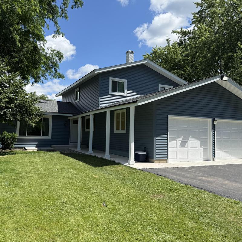 Vinyl siding and asphalt roof on two-story home