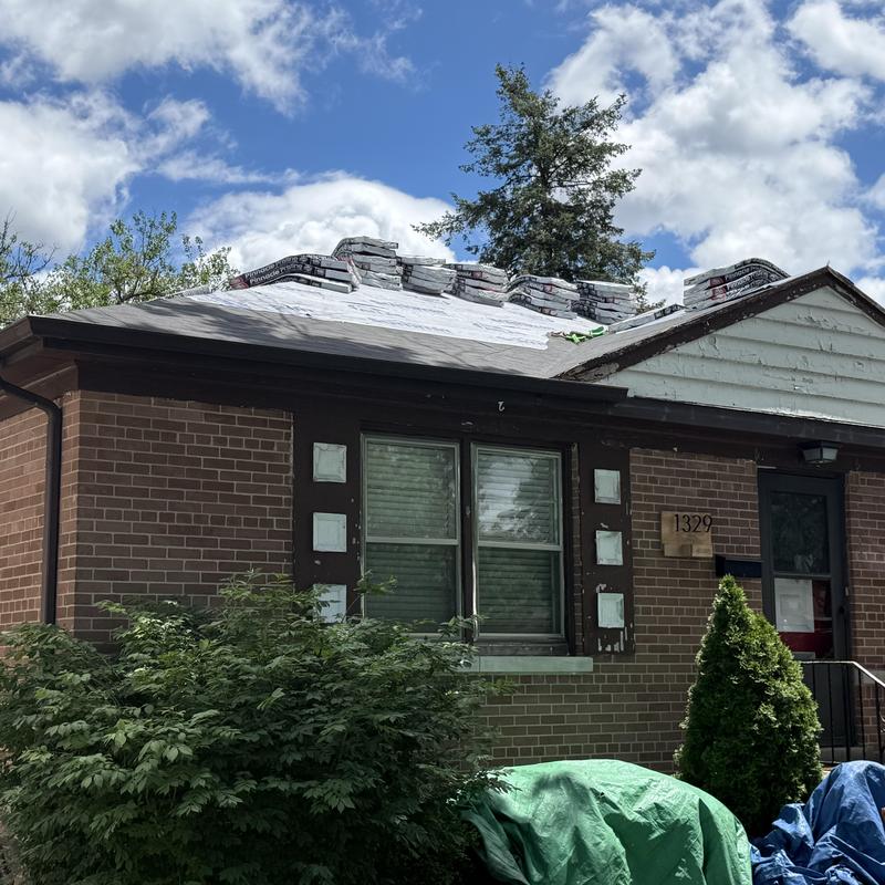 Atlas Pinnacle Pristine asphalt shingles stacked on roof