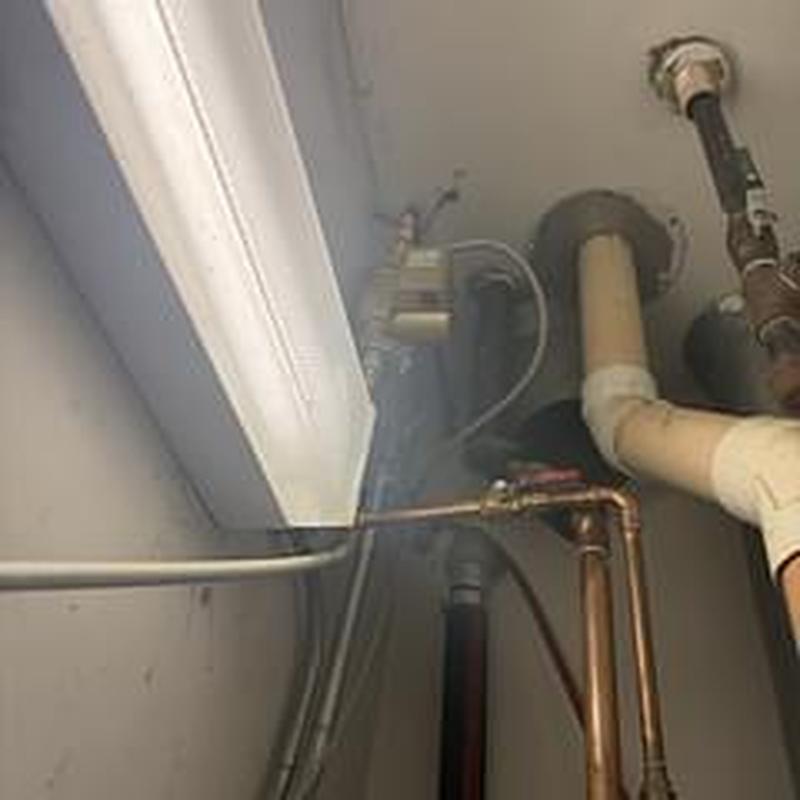 Recirculation pump and copper piping installation near ceiling
