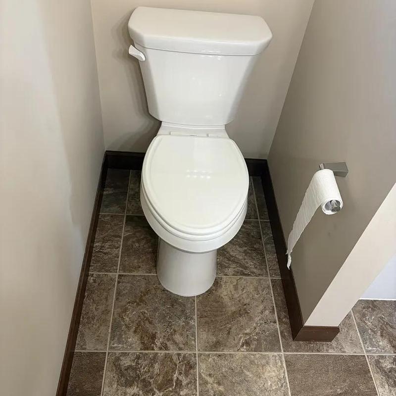 Toilet installation in small bathroom corner