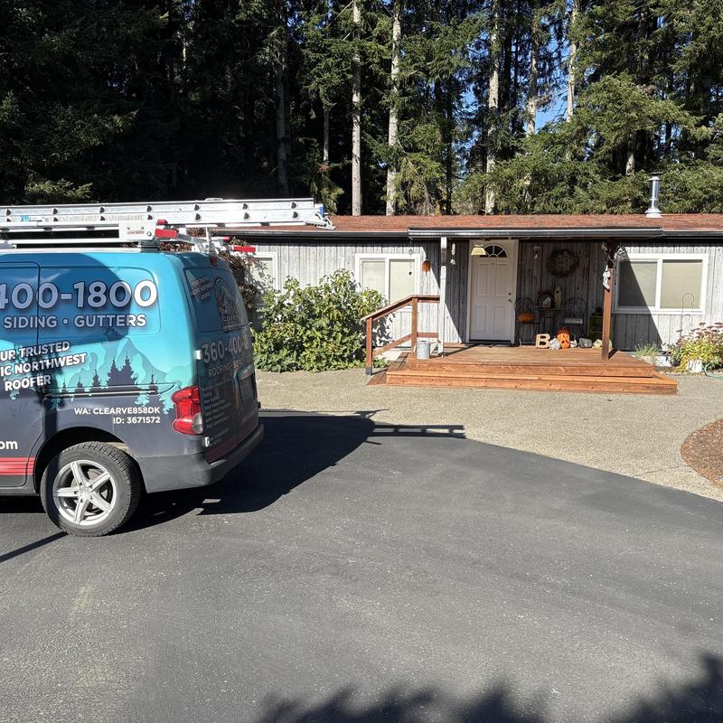 Asphalt shingle roof on residential home with service van