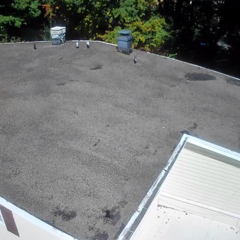 EPDM gravel flat roof with vents and chimney EPDM gravel flat roof with vents and chimney