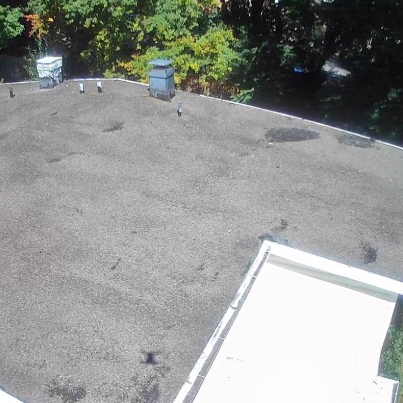 EPDM gravel flat roof with vents and chimney EPDM gravel flat roof with vents and chimney