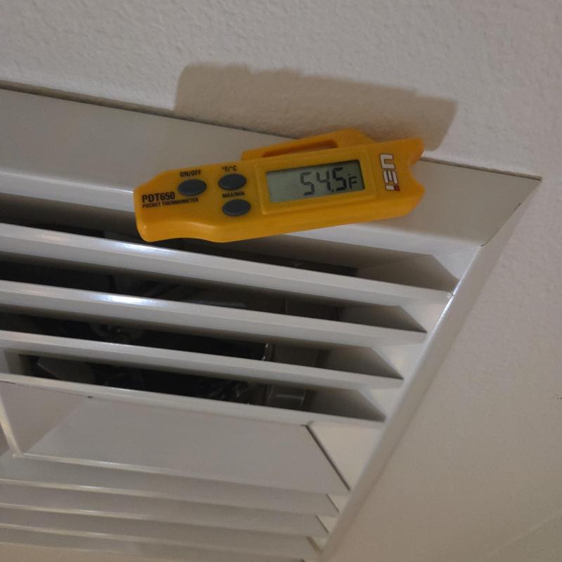 Air vent temperature check with digital thermometer Air vent temperature check with digital thermometer