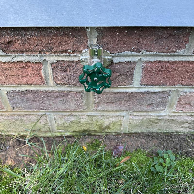 Frost proof hose bib on brick exterior wall
