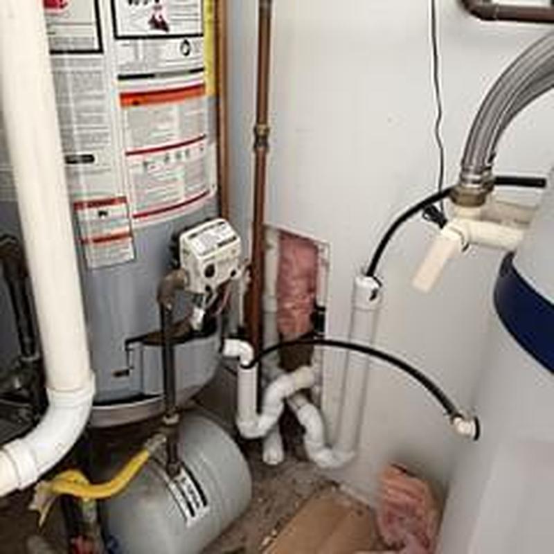 Utility room drain and water heater piping installation