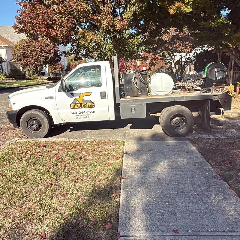 Main sewer line hydro jetting truck parked on street Main sewer line hydro jetting truck parked on street