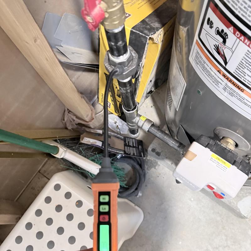 Gas pipe with leak detector by water heater controls