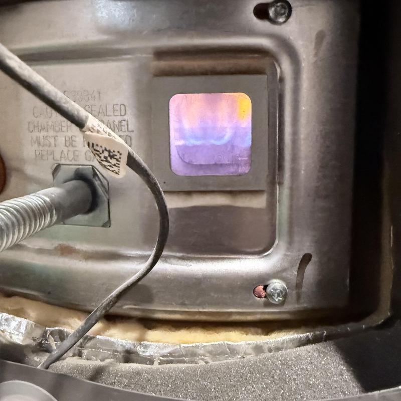 Gas water heater burner flame and pilot view