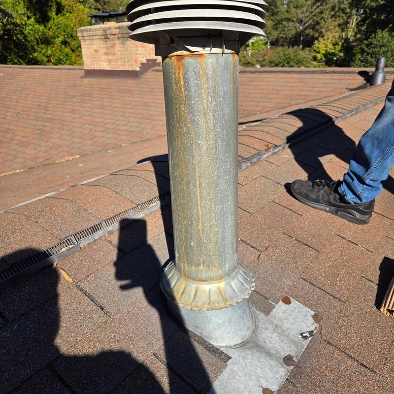 Metal roof vent pipe with collar and flashing on shingles Metal roof vent pipe with collar and flashing on shingles