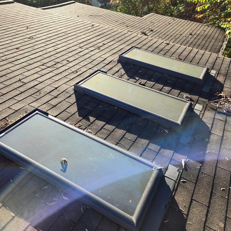 Skylight flashing and pipe collar inspection on roof Skylight flashing and pipe collar inspection on roof