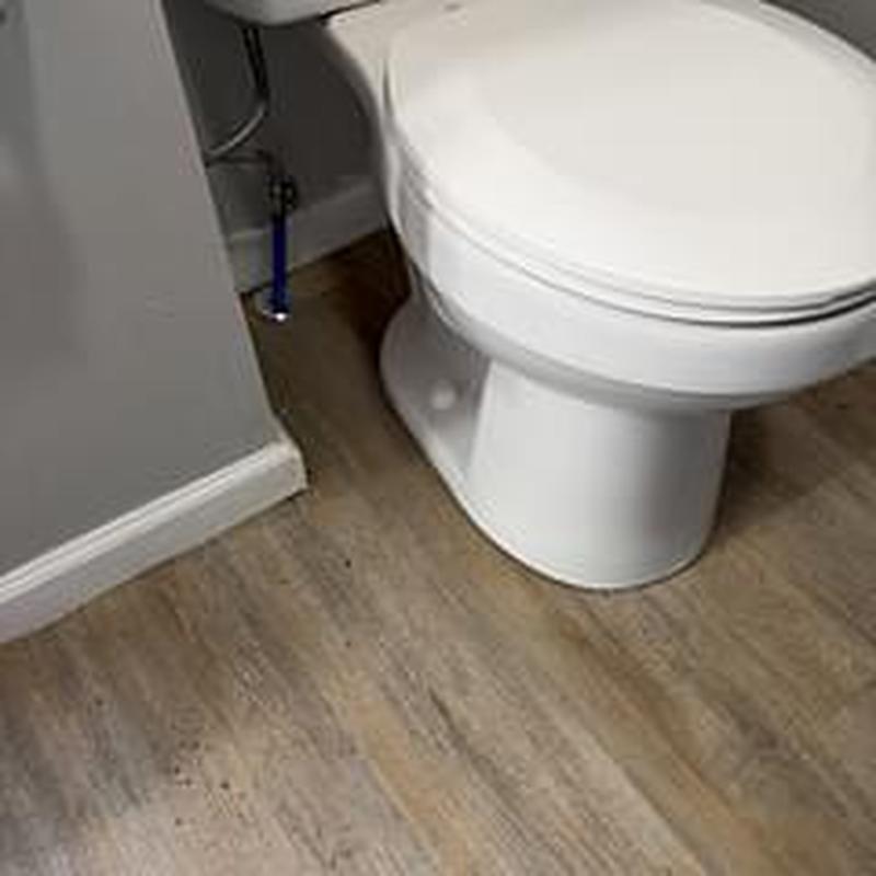 Toilet with removed and reset main branch line clearance