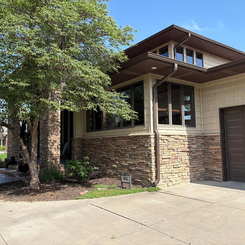 Gutters and downspouts on residential home exterior Gutters and downspouts on residential home exterior