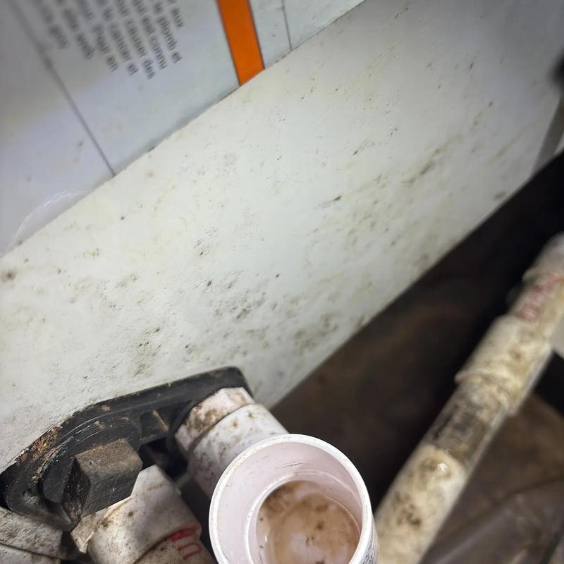 Drain pipe inside HVAC unit crawlspace with condensation water