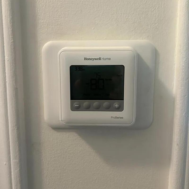 Honeywell Home ProSeries thermostat on wall Honeywell Home ProSeries thermostat on wall