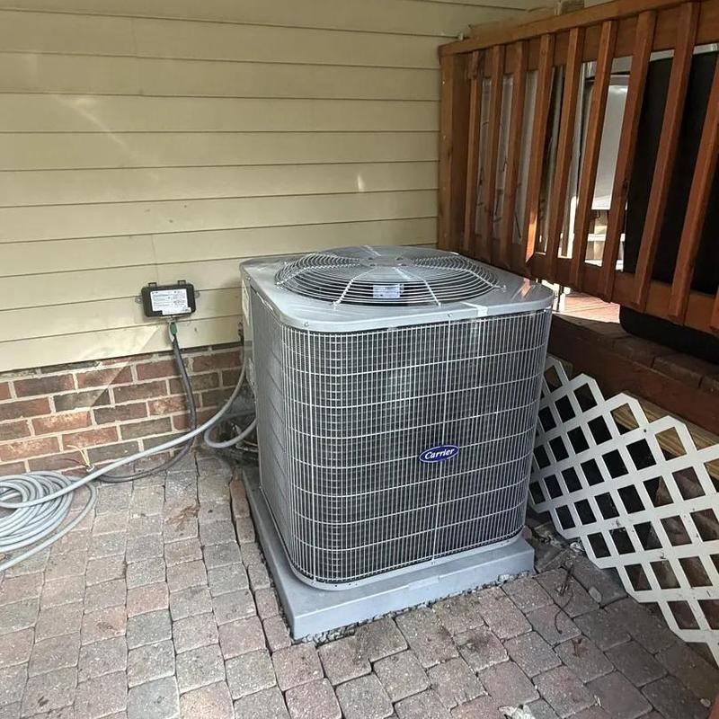 Carrier heat pump unit on concrete pad outdoors Carrier heat pump unit on concrete pad outdoors