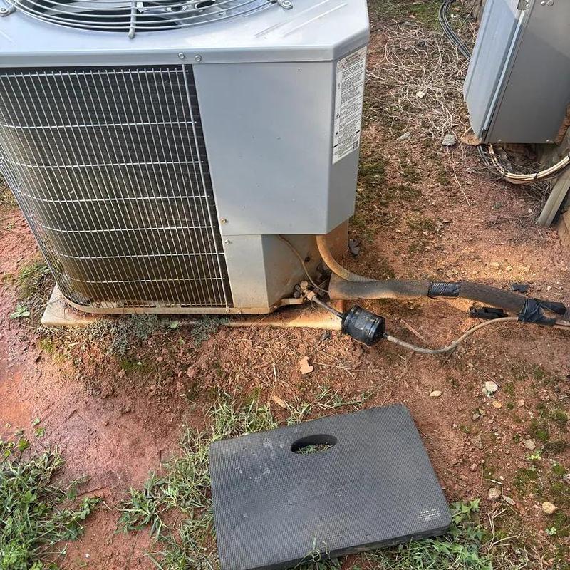 Air conditioner compressor with disconnected refrigerant line Air conditioner compressor with disconnected refrigerant line