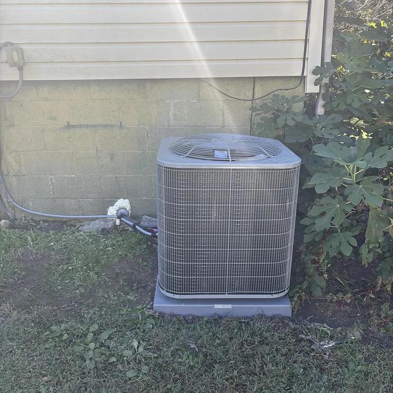 Carrier heat pump unit outside house wall Carrier heat pump unit outside house wall