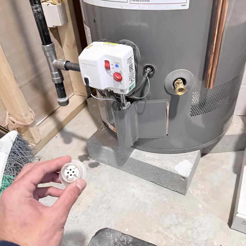 Flammable gas sensor on water heater in basement