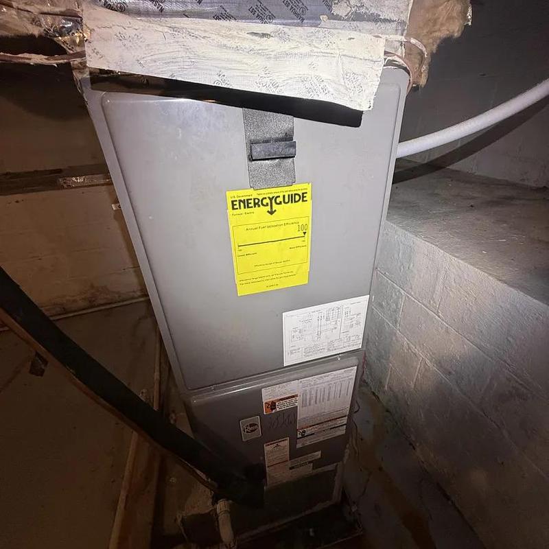 X13 blower motor unit in basement with EnergyGuide label
