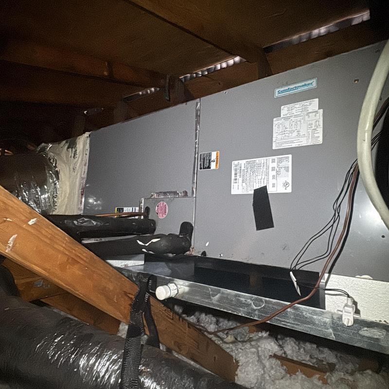 Heating furnace unit in attic with ductwork and wiring Heating furnace unit in attic with ductwork and wiring