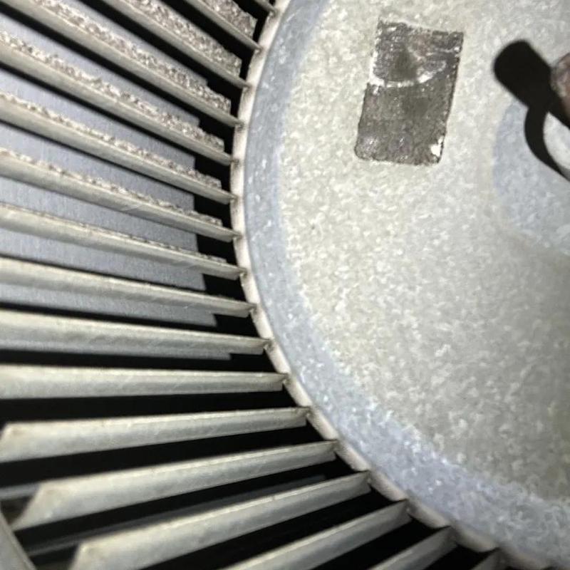 HVAC blower wheel close-up with dust buildup HVAC blower wheel close-up with dust buildup