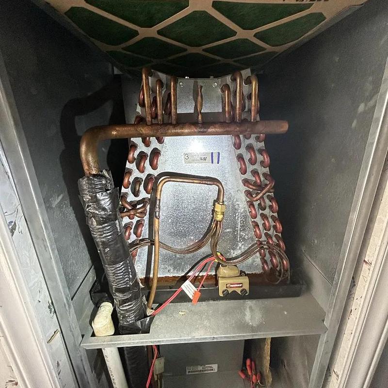 Evaporator coil with copper tubing inside HVAC unit Evaporator coil with copper tubing inside HVAC unit