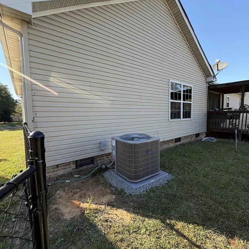 Carrier heat pump unit outside residential home Carrier heat pump unit outside residential home