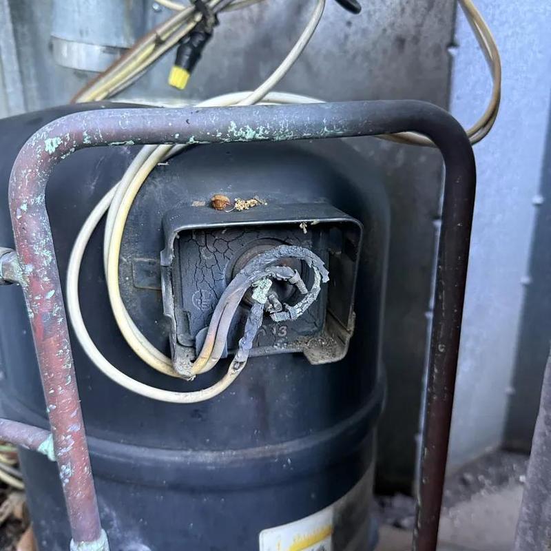 Compressor terminals burnt and wires damaged Compressor terminals burnt and wires damaged