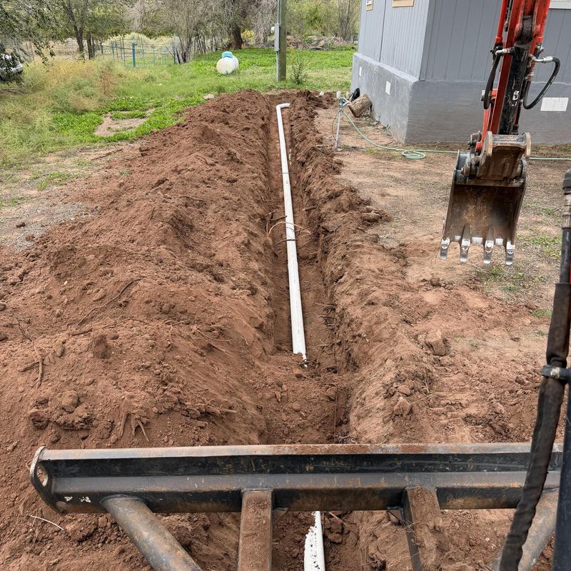 4-inch PVC sewer line with mini excavator trench 4-inch PVC sewer line with mini excavator trench