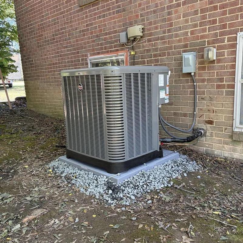 Ruud heat pump unit installed on concrete pad Ruud heat pump unit installed on concrete pad