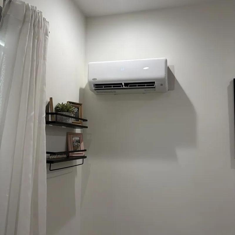 Mini split air conditioner installed in room wall Mini split air conditioner installed in room wall
