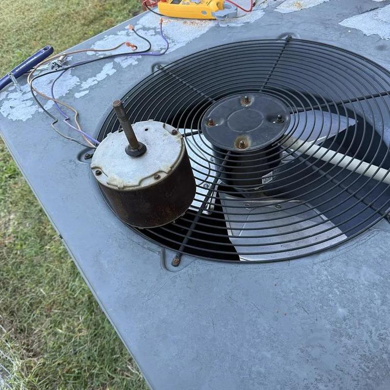 Condenser fan motor removed from air conditioning unit Condenser fan motor removed from air conditioning unit