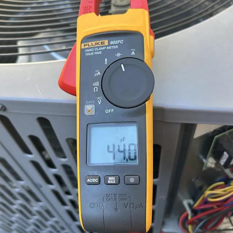 HVAC clamp meter measuring microfarads on unit fan coil HVAC clamp meter measuring microfarads on unit fan coil