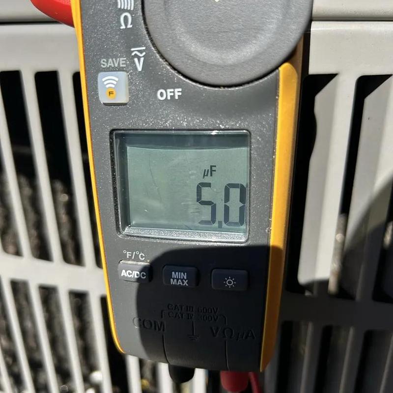 Multimeter measuring capacitor microfarads on HVAC unit Multimeter measuring capacitor microfarads on HVAC unit