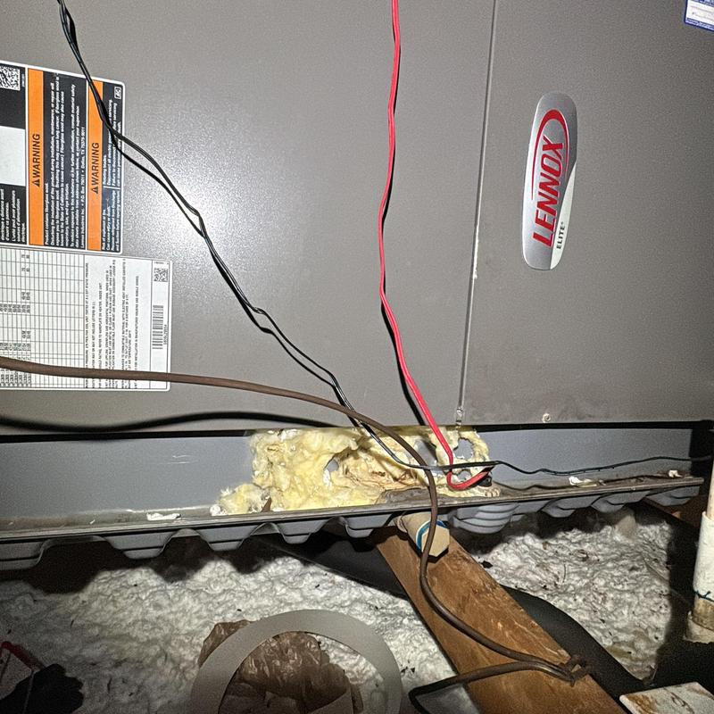 HVAC unit ductwork damaged by critters with insulation exposed HVAC unit ductwork damaged by critters with insulation exposed