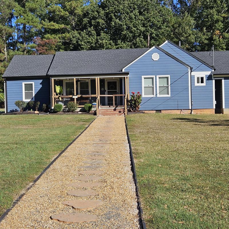 Blue siding with new porch and painted shutters