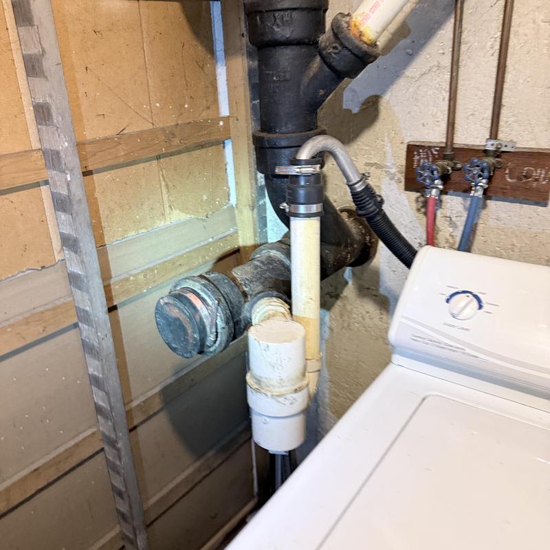Main drain pipe with washing machine hookups and valves