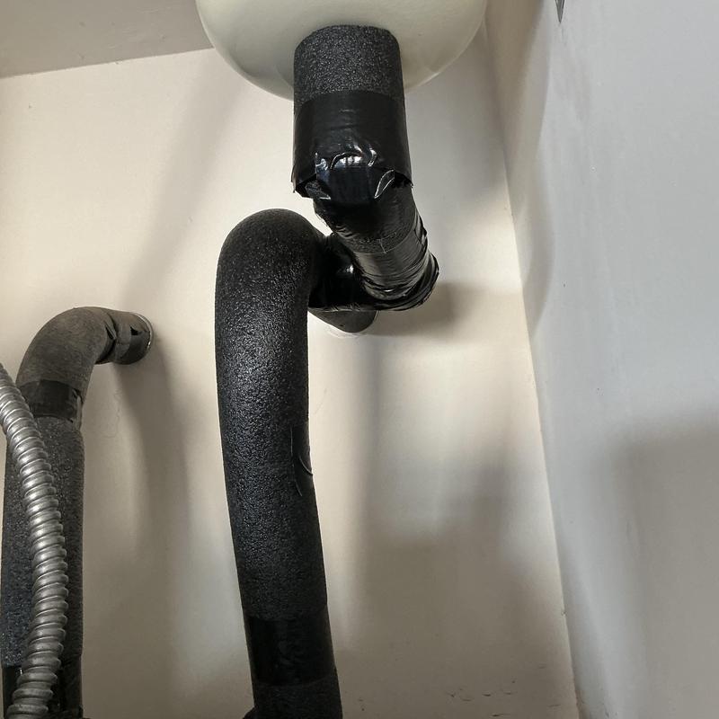 Water heater expansion tank piping with insulation wrap