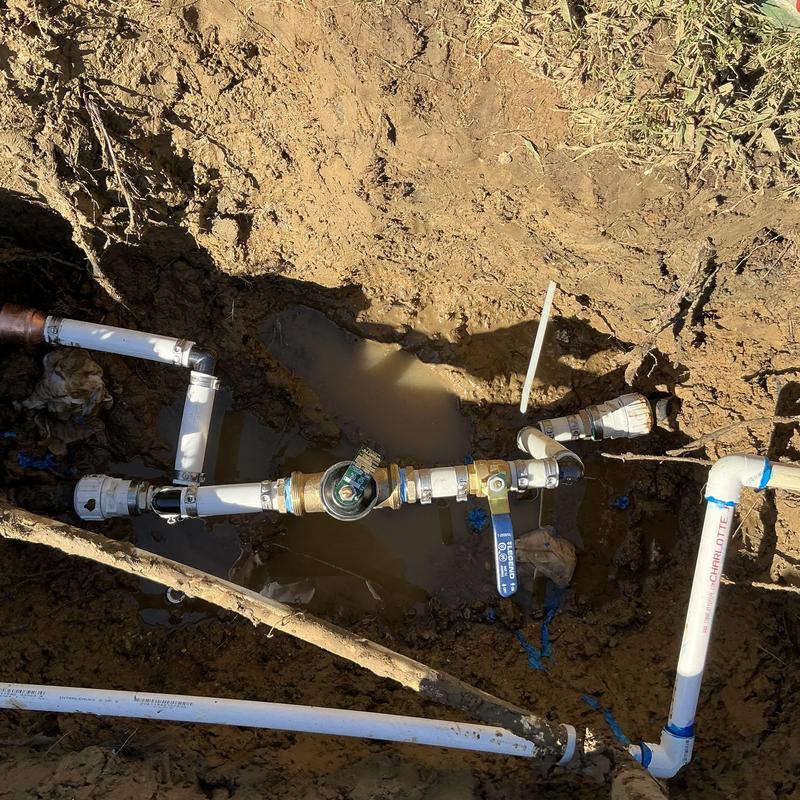 Main water line with ball valve and pressure gauge
