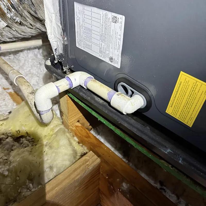 Drain pan with PVC piping and cracked edge Drain pan with PVC piping and cracked edge