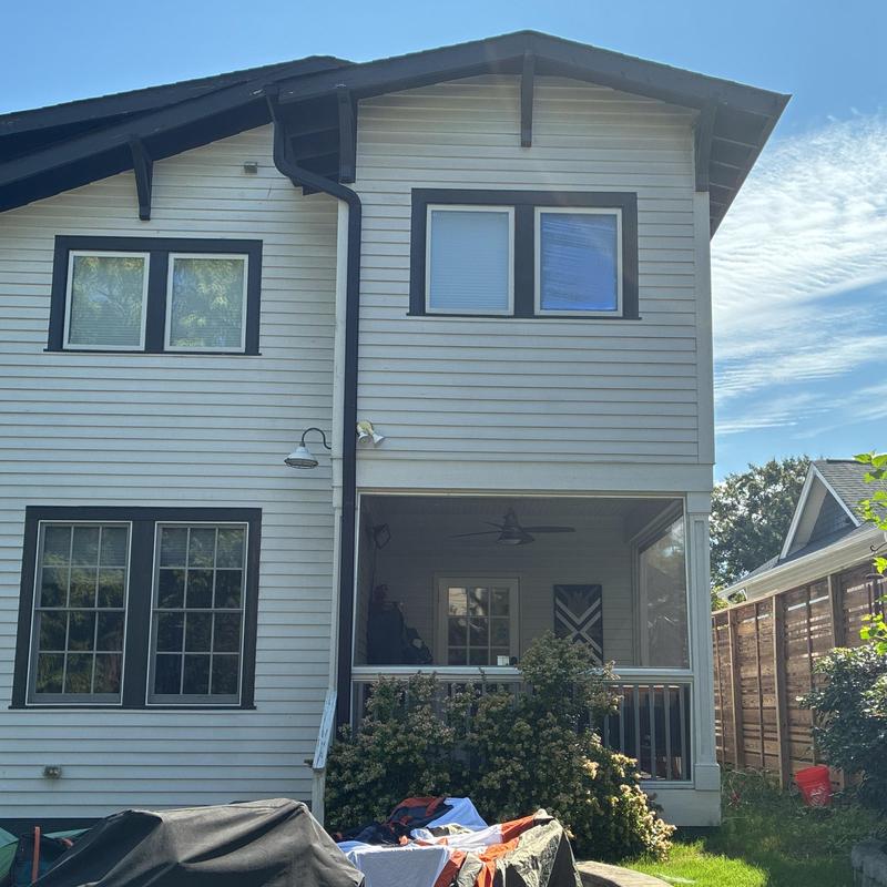 Vinyl siding installation on two-story home exterior