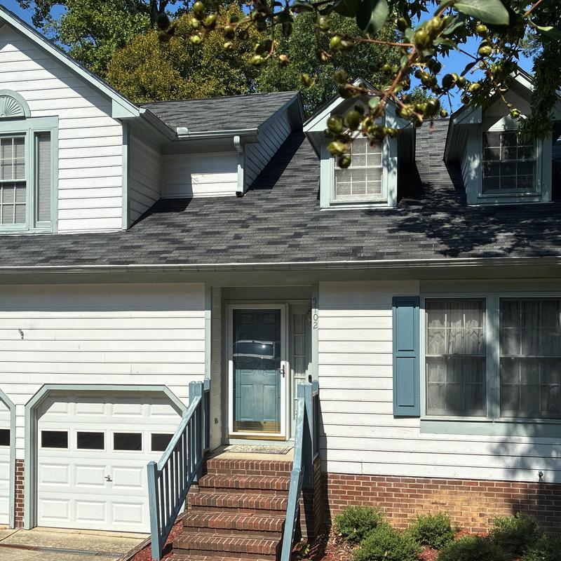 Asphalt shingle roof and front porch entrance