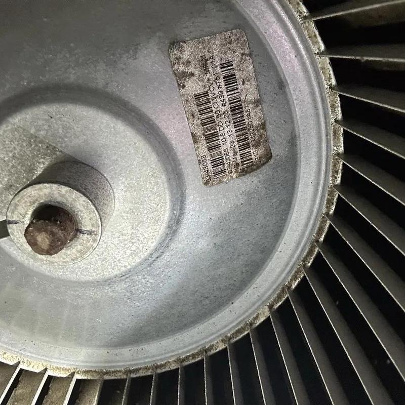 HVAC blower wheel with identification sticker close-up HVAC blower wheel with identification sticker close-up