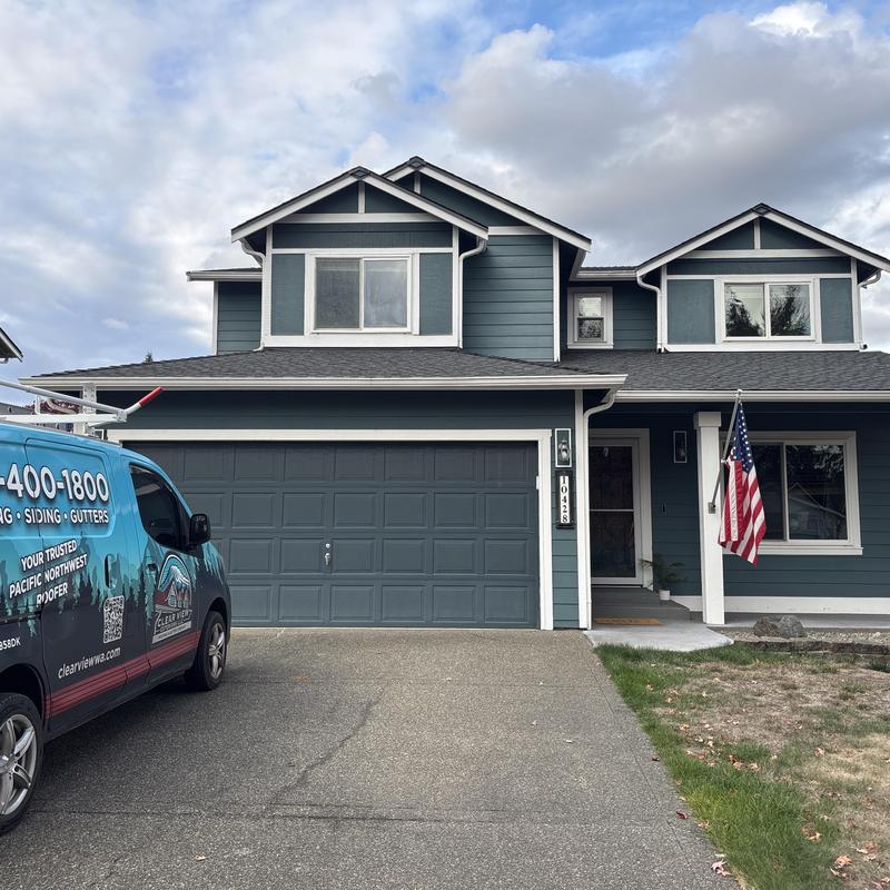 Asphalt shingle roof inspection on two-story house