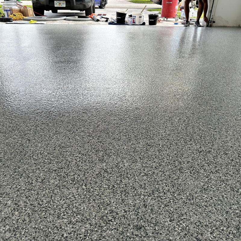 Gravel flake epoxy garage floor with polyaspartic topcoat