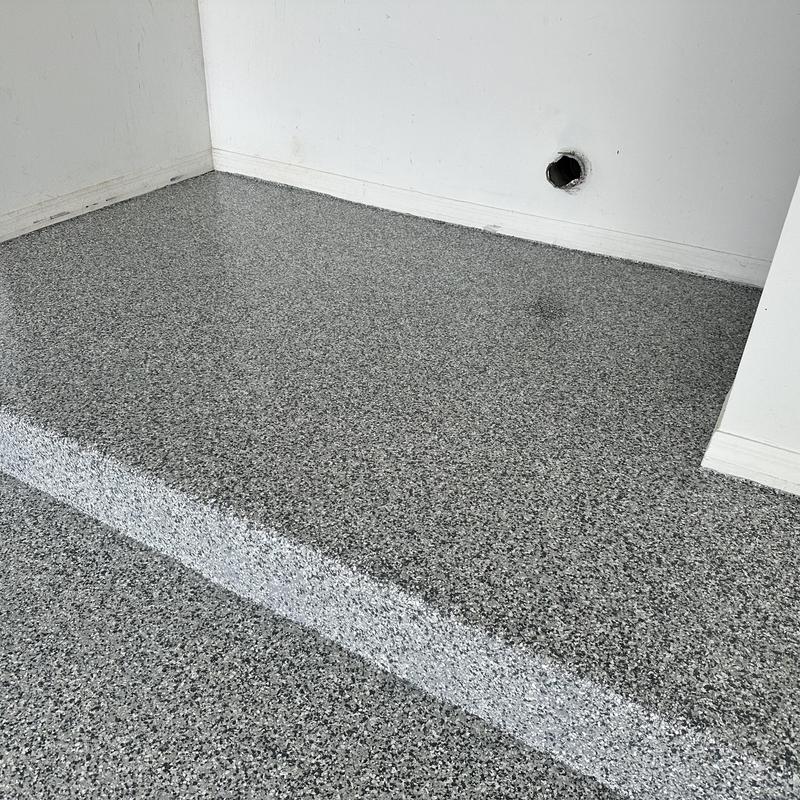 Gravel flake epoxy garage floor with step detail