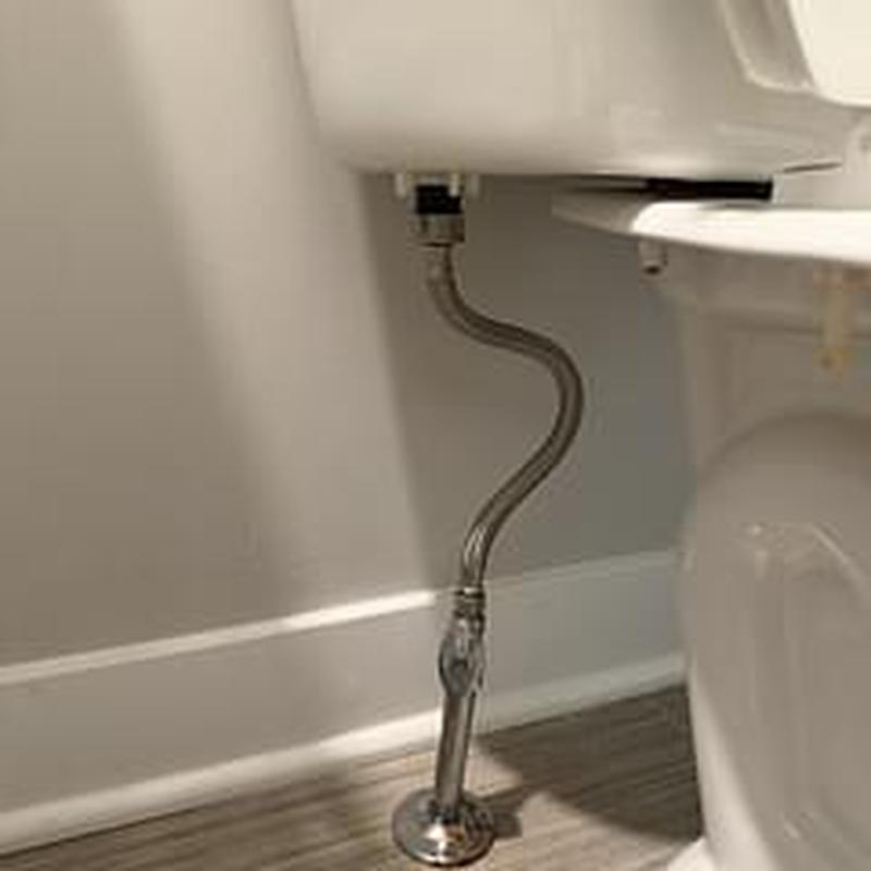 Toilet water supply line and valve below tank