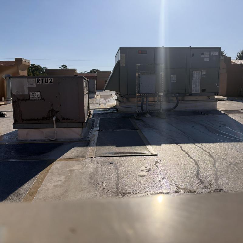 RTUs on rooftop with maintenance inspection